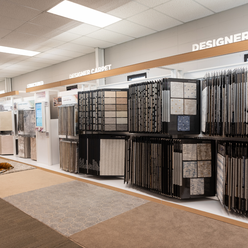 Carpet One Spartanburg showroom with designer carpet displays and samples.
